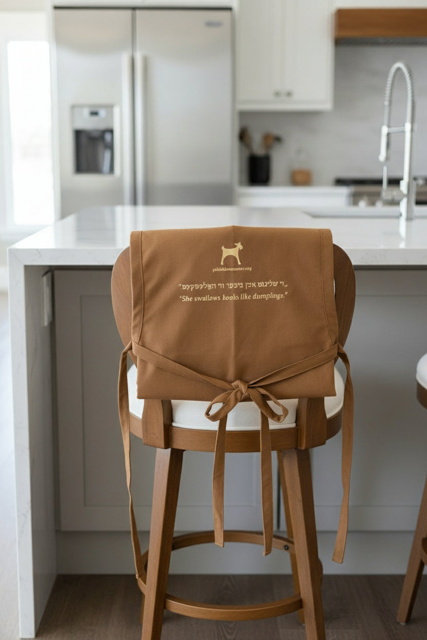 Apron "She swallows books like dumplings." ---Sholem Aleichem